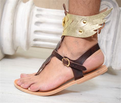 picture of biblical hermes putting sandal on|Hermes wearing sandals.